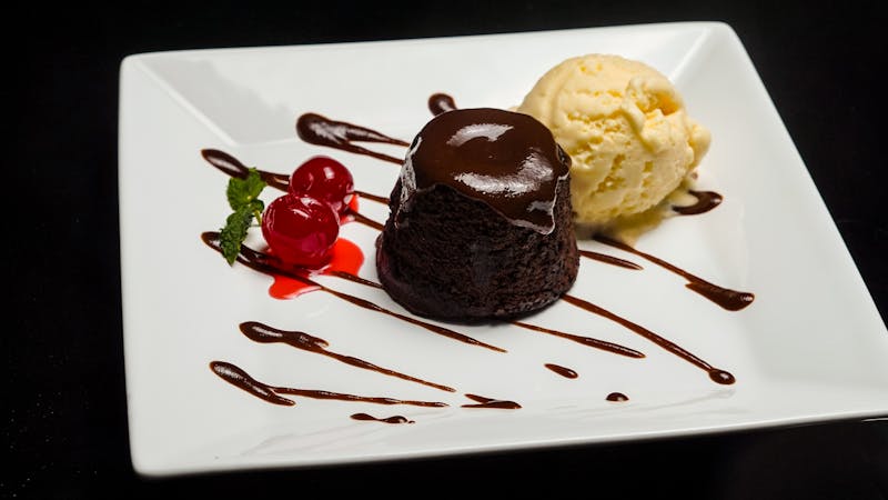 warm chocolate lava cake with vanilla ice cream and caramel sauce