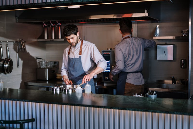 Pizza factory kitchen team at work in Plymouth
