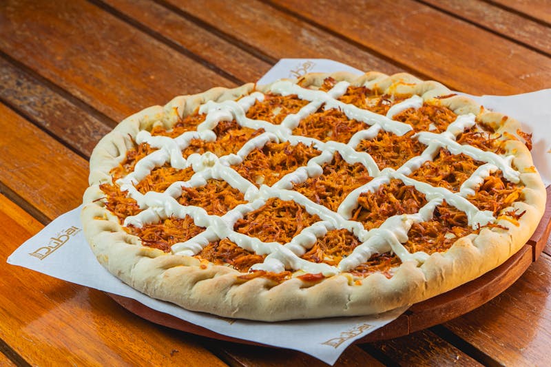 BBQ chicken loaded pizza with smoky barbecue sauce from pizza factory